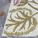 Corner view of Couristan Dolce Indoor/Outdoor Rug - Tivoli/Ivory-Multi highlights its olive green floral design and clean ivory edging