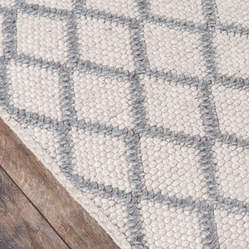 Corner view of Momeni Andes Indoor Rug - AND-7 Natural highlights its durable edges and handcrafted woven texture
