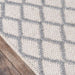 Corner view of Momeni Andes Indoor Rug - AND-7 Natural highlights its durable edges and handcrafted woven texture