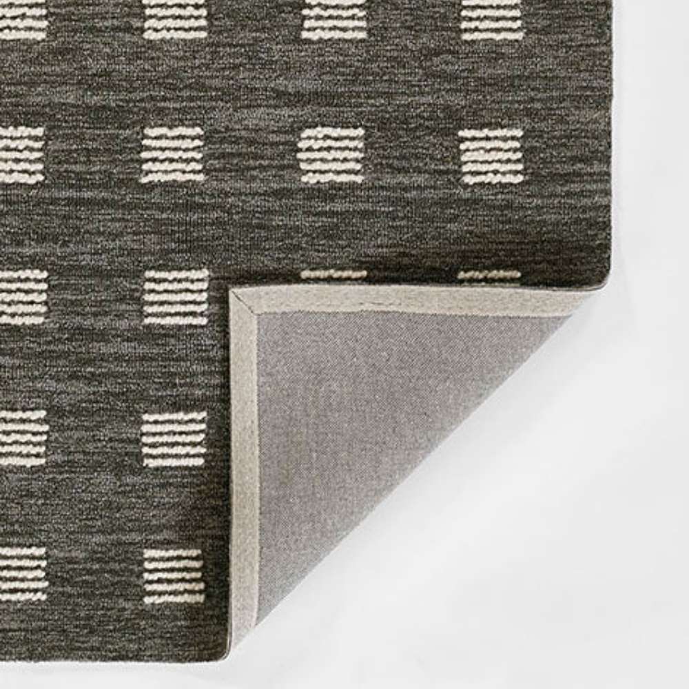 Corner view of Momeni Archer Indoor Rug - ARC-1 Charcoal reveals its soft woven underside and cleanly finished edges