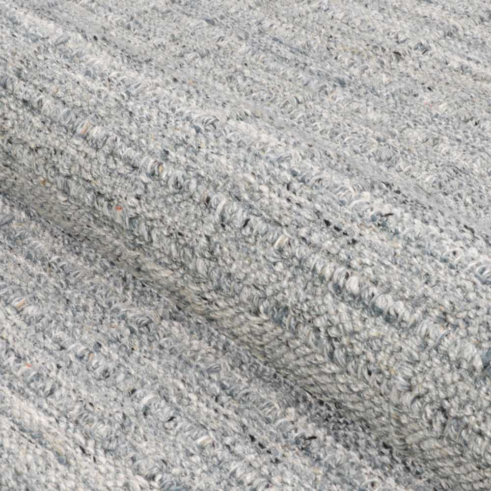 Couristan Ascot Indoor/Outdoor Rug - Windowpane/Grey is shown in a rolled-up view to highlight its soft, looped texture and subtle pattern