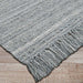 Couristan Ascot Indoor/Outdoor Rug - Windowpane/Tweed is shown at an angle, emphasizing its strong weave and tidy corner fringe