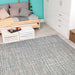 Couristan Cape Indoor/Outdoor Rug - Falmouth/Ivory-Coral is spread out in a cozy bedroom, adding a colorful accent to the light wood floor and furniture