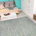 Couristan Cape Indoor/Outdoor Rug - Falmouth/Ivory-Hunter is shown in a cozy bedroom