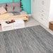 Couristan Cape Indoor/Outdoor Rug - Fayston/Silver-Charcoal is placed in a cozy, modern room with light wood flooring, a daybed, and bright teal walls