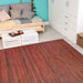 Couristan Cape Indoor/Outdoor Rug - Hinsdale/Crimson-Multi is laid out in a cozy, modern room with a wooden daybed and white furniture
