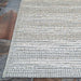 Couristan Cape Indoor/Outdoor Rug - Shallows/Taupe-Grey is shown on a stone patio