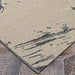 Couristan Castille Indoor/Outdoor Rug - Canvas/Glacier is pictured on stone tiles