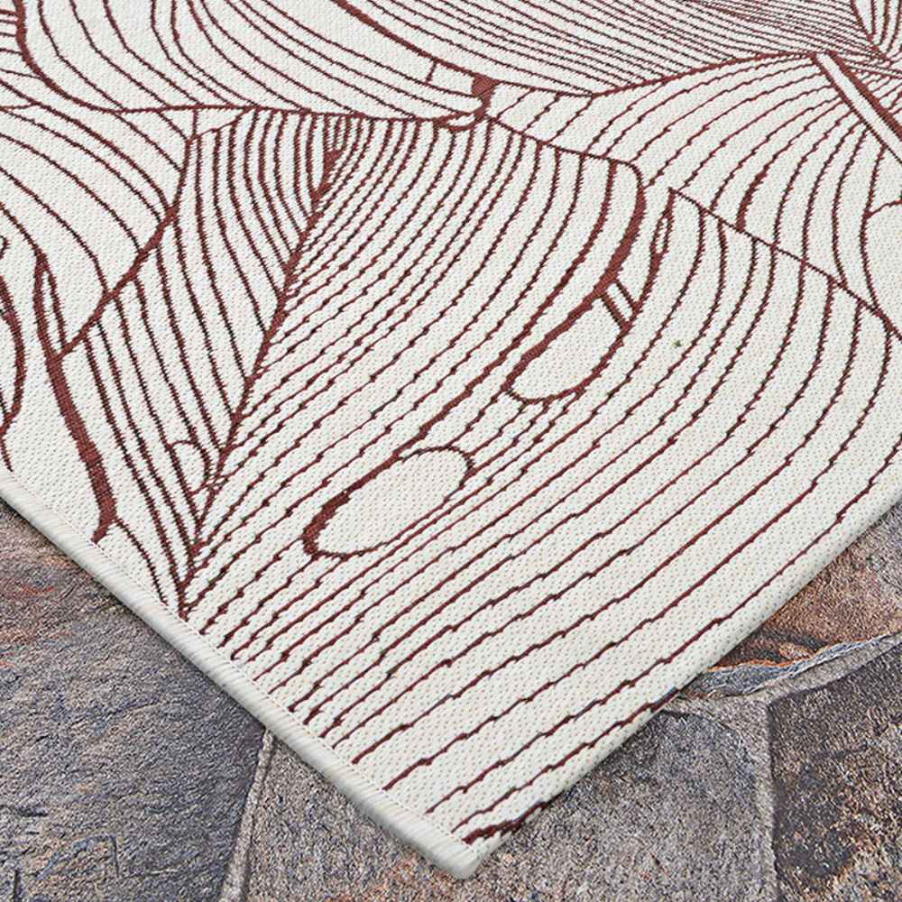 Couristan Castille Indoor/Outdoor Rug - Palma/Rouge is captured from another corner angle, focusing on its detailed line art and smooth surface