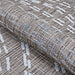 Couristan Charm Indoor/Outdoor Rug - Aurora/Twig is partially rolled to highlight its thick weave and subtle mix of twig, ivory, and blue tones