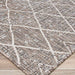 Couristan Charm Indoor/Outdoor Rug - Thicket/Twig is pictured from an angle to show its flatwoven structure and repeating geometric pattern
