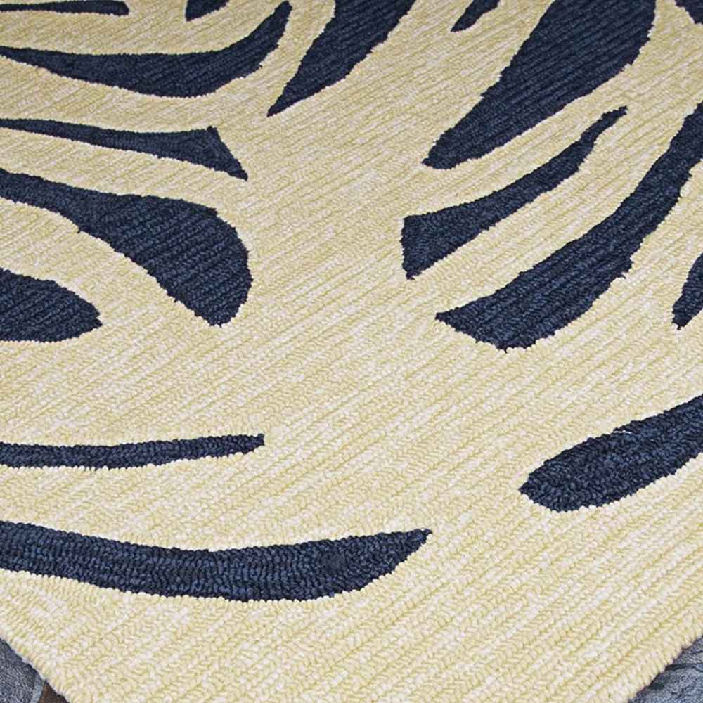 Couristan Covington Indoor/Outdoor Rug - Palms/Navy features a bold palm-leaf design in navy on a light ivory background