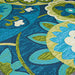 Couristan Covington Indoor/Outdoor Rug - Rip Tide/Ocean-Green displays a richly textured surface with swirling floral and leaf designs in shades of green, blue, and cream