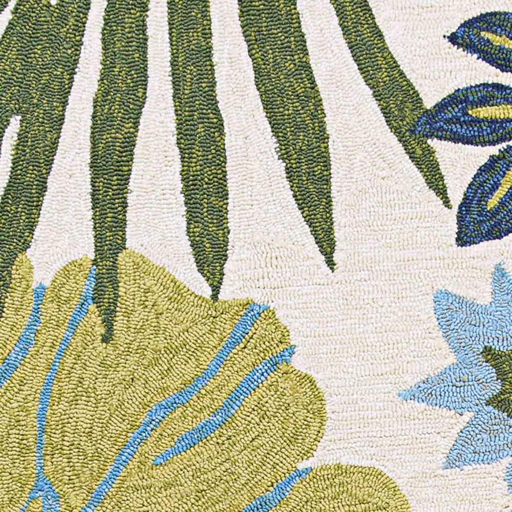 Couristan Covington Indoor/Outdoor Rug - Summer Laelia/Ivory-Fern displays tropical leaves and floral patterns in light green, blue, and ivory