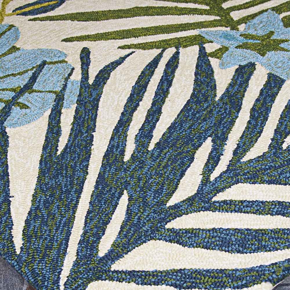 Couristan Covington Indoor/Outdoor Rug - Summer Laelia/Ivory-Fern features detailed palm fronds in blue and green against an ivory background