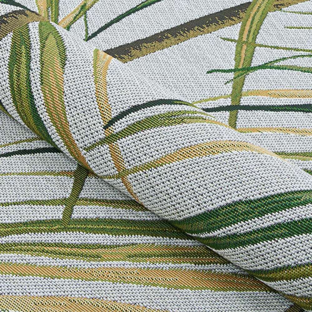 Couristan Dolce Indoor/Outdoor Rug - Bamboo Forest/Frost is shown gently folded