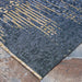 Couristan Dolce Indoor/Outdoor Rug - Blue Nile/Indigo is displayed lying flat on stone tiles