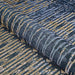 Couristan Dolce Indoor/Outdoor Rug - Blue Nile/Indigo is partially rolled