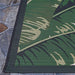 Couristan Dolce Indoor/Outdoor Rug - Palm Lily/Hunter Green-Ivory highlights its tight weave and vibrant leaf design in green and tan