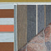 Couristan Dolce Indoor/Outdoor Rug - Striped/Sunset is shown partially flipped to reveal the contrasting darker stripe pattern on the reverse side