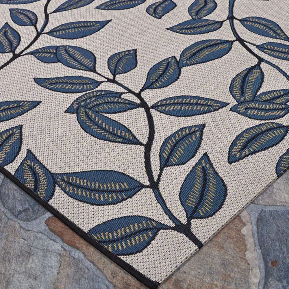 Couristan Dolce Indoor/Outdoor Rug - Summer Ivy/Ivory-Slate Blue features an intricate leaf pattern in slate blue on a tightly woven ivory background