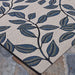 Couristan Dolce Indoor/Outdoor Rug - Summer Ivy/Ivory-Slate Blue features an intricate leaf pattern in slate blue on a tightly woven ivory background
