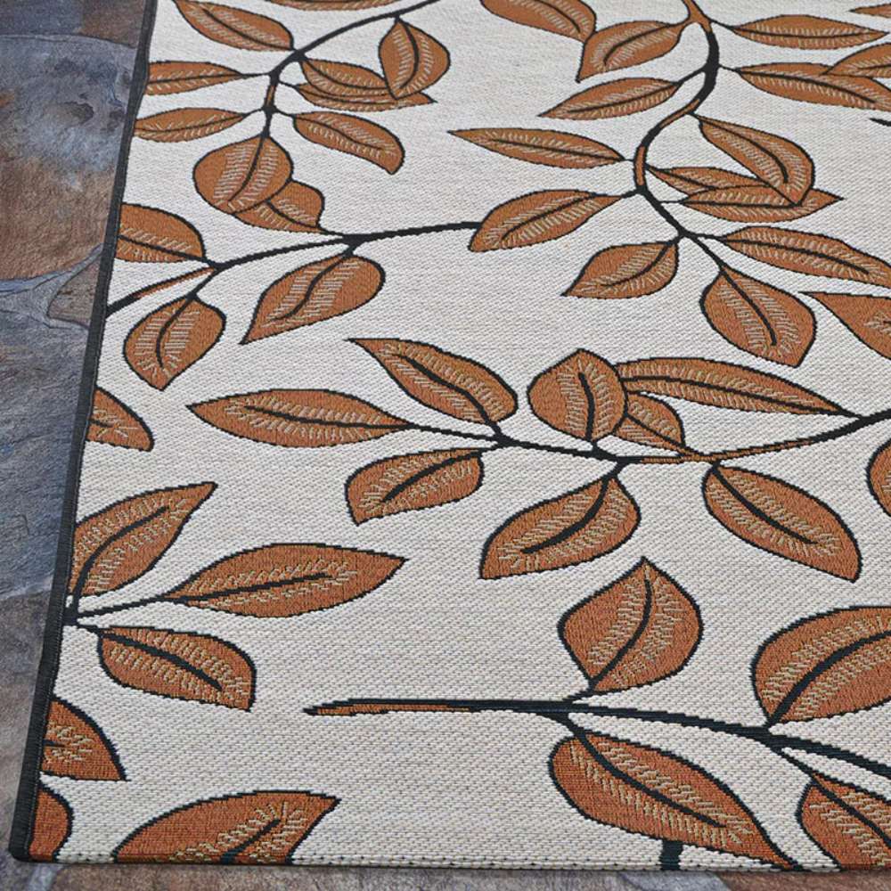 Couristan Dolce Indoor/Outdoor Rug - Summer Ivy/Ivory-Terra-Cotta shows a wide view of its terra-cotta leaves on ivory background