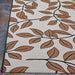 Couristan Dolce Indoor/Outdoor Rug - Summer Ivy/Ivory-Terra-Cotta shows a wide view of its terra-cotta leaves on ivory background
