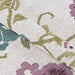 Couristan Dolce Indoor/Outdoor Rug - Tivoli/Ivory-Multi is gently folded to show its soft texture and intricate floral patterns in green, purple, and teal