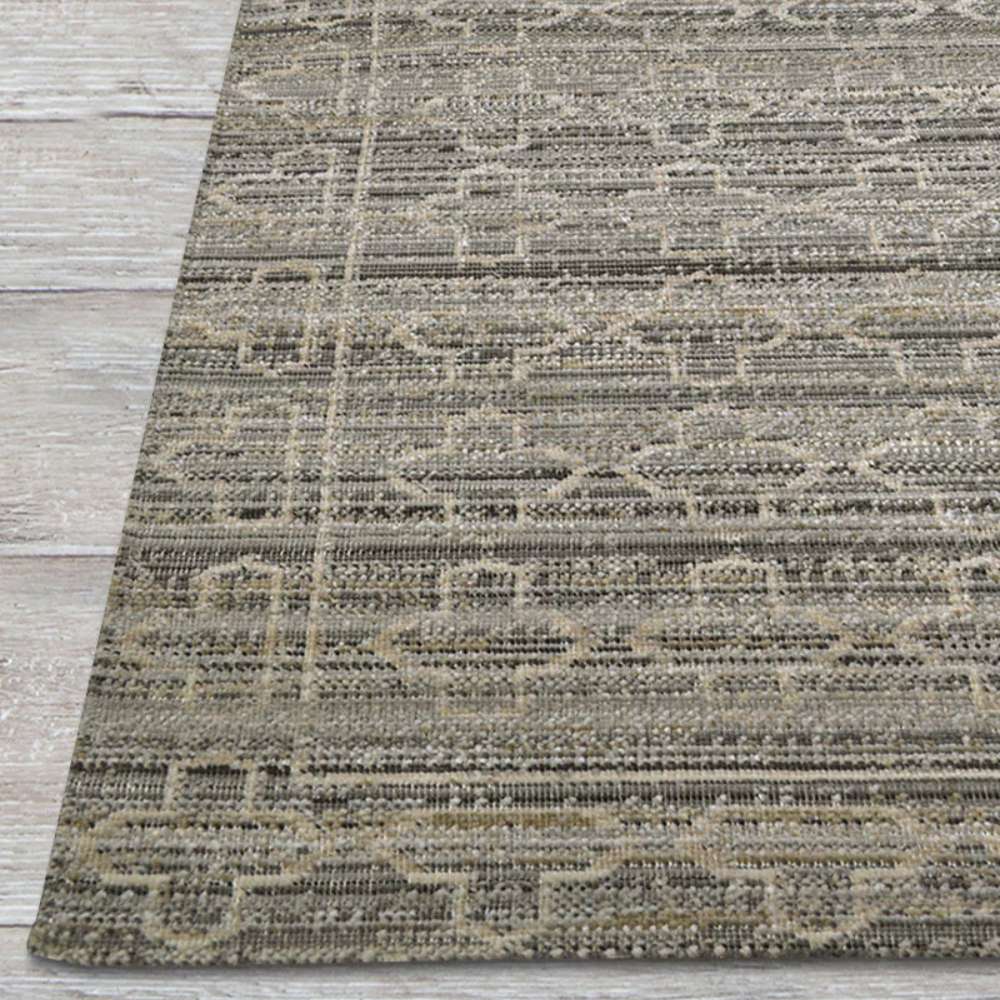 Couristan Fez Indoor/Outdoor Rug - Riad/Ash is pictured from the edge highlighting its finely woven texture and muted beige and gray design