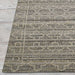 Couristan Fez Indoor/Outdoor Rug - Riad/Ash is pictured from the edge highlighting its finely woven texture and muted beige and gray design