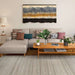 Couristan Fez Indoor/Outdoor Rug - Sidi/Sunlight is shown in a cozy living room under a sectional sofa and wooden coffee table