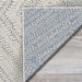 Couristan Liguria Indoor/Outdoor Rug - Levanto/Aqua is displayed close-up with its textured weave visible on both the front and back sides