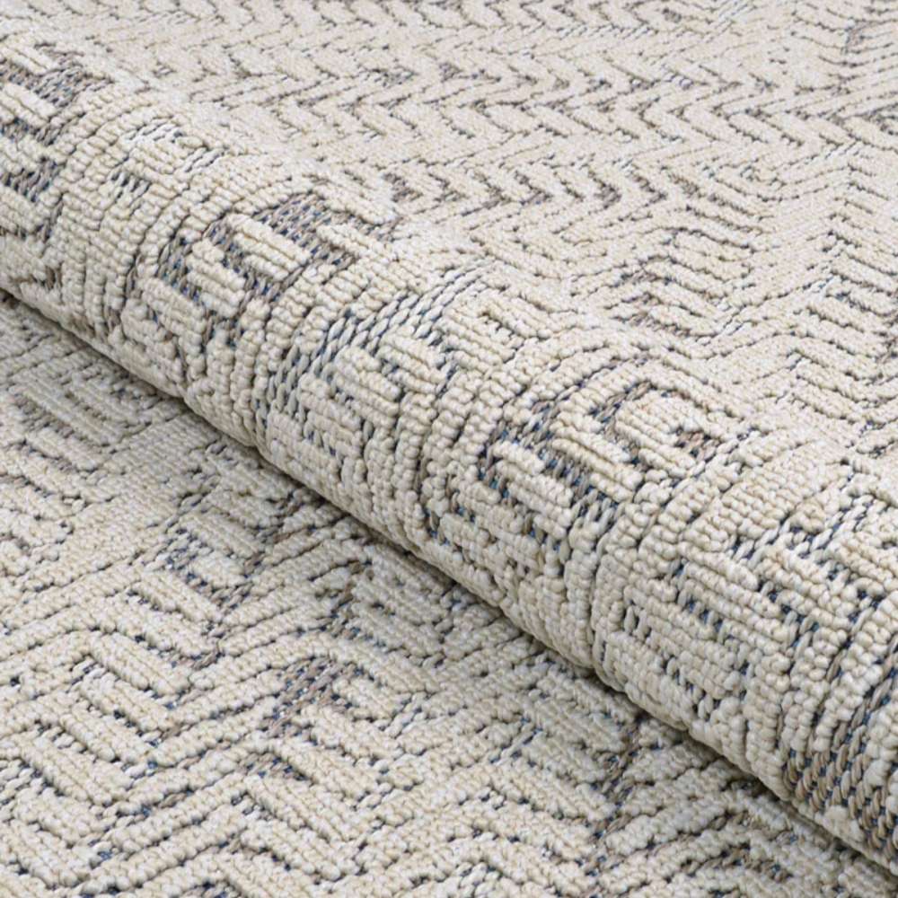 Couristan Liguria Indoor/Outdoor Rug - Levanto/Aqua is partially rolled
