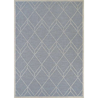 Couristan Liguria Indoor/Outdoor Rug - Noli/Azul features a soft blue background with ivory diamond patterns woven across its surface