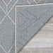 Couristan Liguria Indoor/Outdoor Rug - Noli/Azul is shown flipped at the corner revealing its sturdy and reversible weave