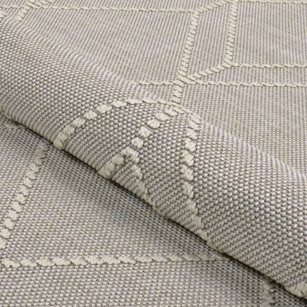 Couristan Liguria Indoor/Outdoor Rug - Noli/Dove Grey is shown partially folded