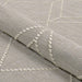Couristan Liguria Indoor/Outdoor Rug - Noli/Dove Grey is shown partially folded