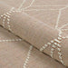 Couristan Liguria Indoor/Outdoor Rug - Noli/Umber is rolled to display its flexible woven texture and raised ivory details