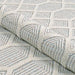 Couristan Liguria Indoor/Outdoor Rug - Rapallo/Aqua is rolled slightly to highlight its flexibility and raised texture