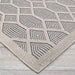 Couristan Liguria Indoor/Outdoor Rug - Rapallo/Pebble is displayed at an angle showing its diamond shapes and tightly bound edges