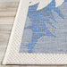 Couristan Monaco Indoor/Outdoor Rug - Coastal Flora/Ivory-Sapphire displays a crisp ivory border framing its botanical sapphire pattern
