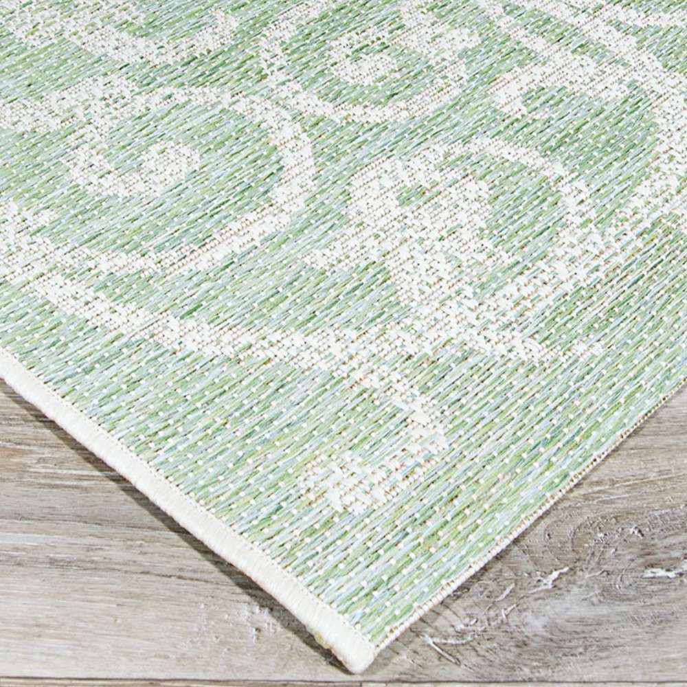 Couristan Monaco Indoor/Outdoor Rug - Summer Quay/Ivory-Light Green displays a flat detailed edge with a swirl pattern in light green and ivory