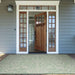 Couristan Monaco Indoor/Outdoor Rug - Summer Quay/Ivory-Light Green lies at a front door entryway