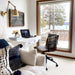 Cozy workspace with Crate & Barrel Graham Brown Office Chair beside a white desk and large window view