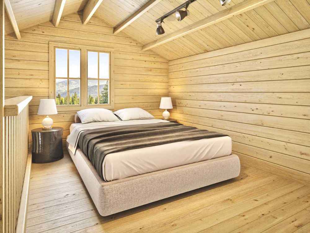 Cozy loft bedroom with a double bed, two lamps, and a mountain view window showcases the peaceful sleeping area inside the Sawmill Structures BlueWater Loft 160 38mm Garden Room