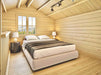 Cozy loft bedroom with a double bed, two lamps, and a mountain view window showcases the peaceful sleeping area inside the Sawmill Structures BlueWater Loft 160 38mm Garden Room