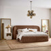 Crate & Barrel Adelaide Curved Upholstered Bed styled in a modern bedroom with neutral bedding, wood accents, and soft lighting