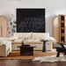 Crate & Barrel Annie 38" Natural Storage Cabinet displayed in a cozy living room with open shelving and decorative accents