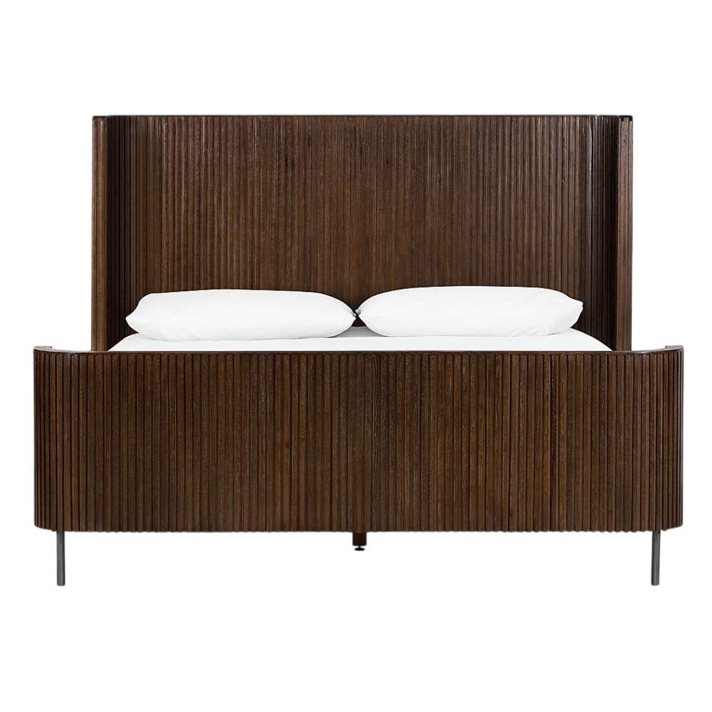 Crate & Barrel Baylor Brown Ribbed Solid Oak Wood Queen Bed is shown from the front with a tall ribbed headboard, matching footboard, and slim metal legs